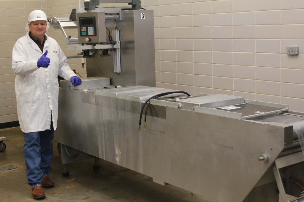 Ray Riley with Rollstock Packaging Machine donated by Texas Meat Purveyors