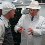 Alan Healy (right) discussing business with long-time butcher
