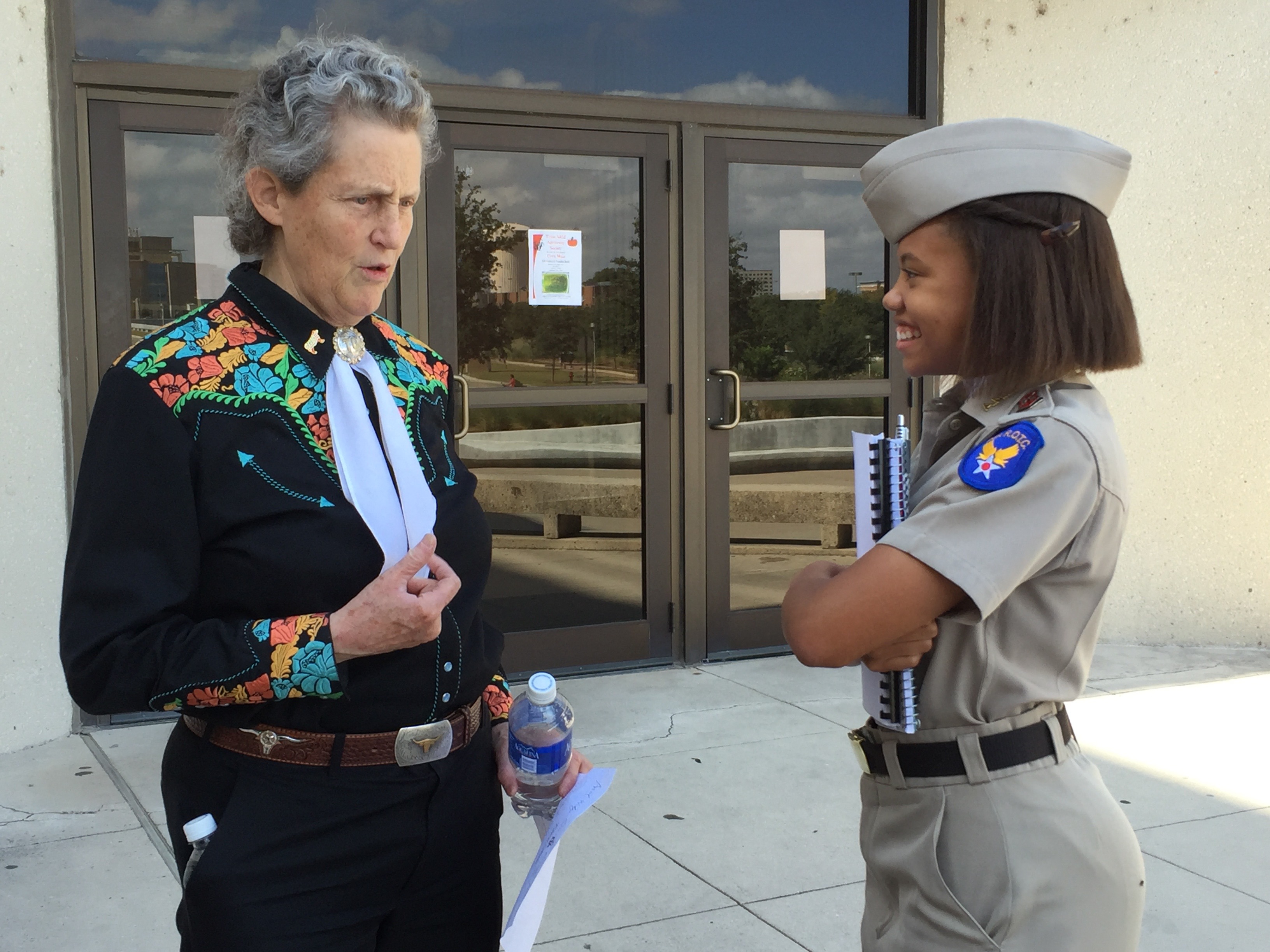Dr. Temple Grandin visiting with student after ANSC 107 class