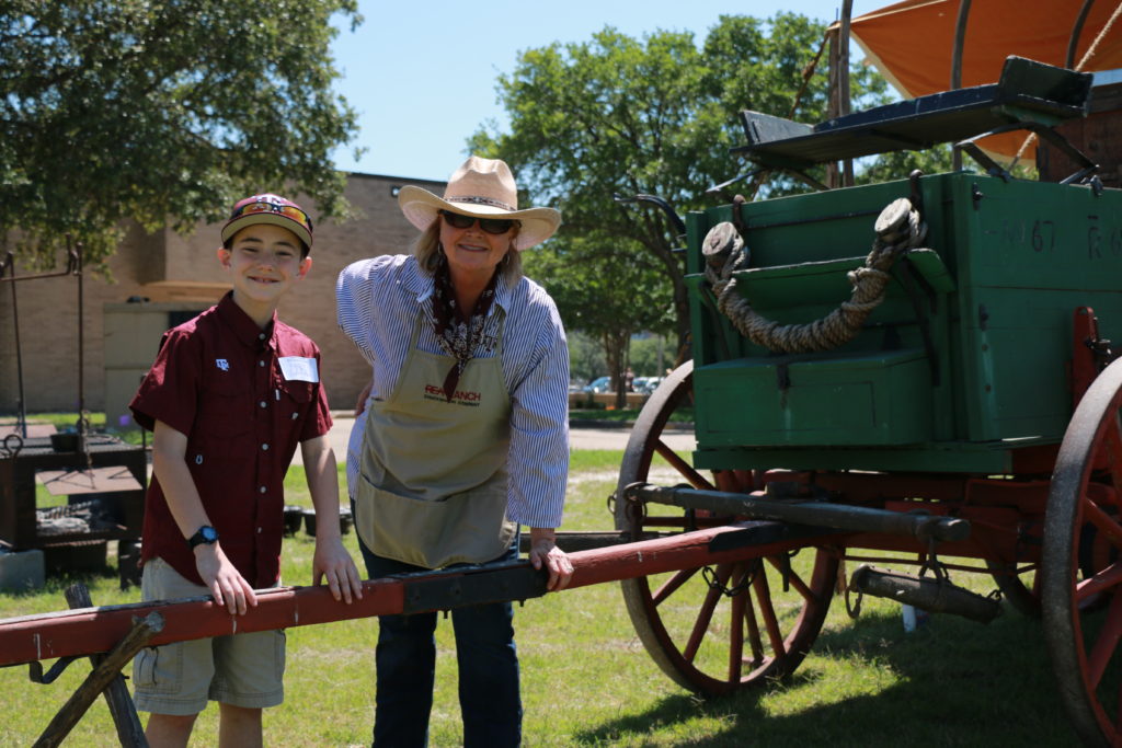 Jackson Larriviere and Karen Nickelson showing off the chuck wagon