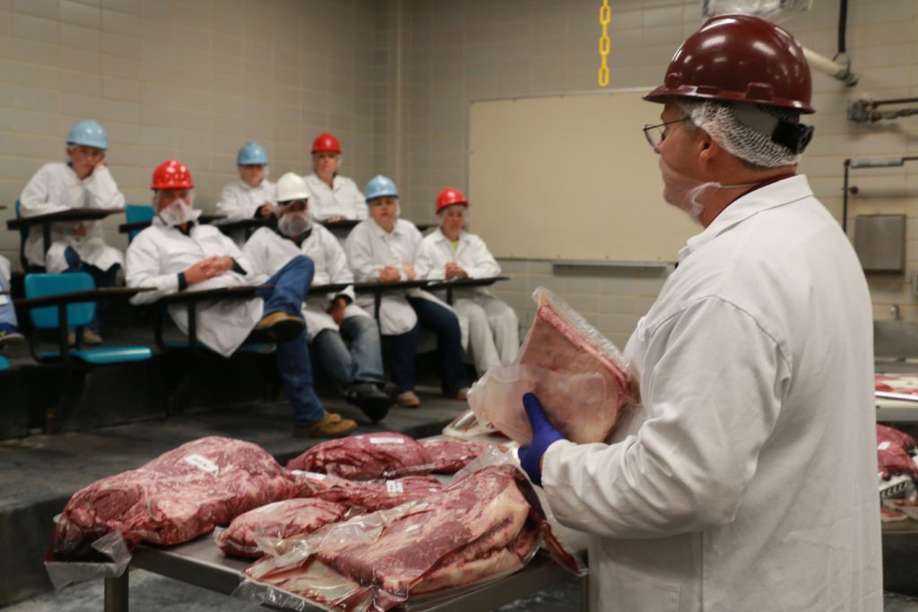 Davey Griffin showing various cuts of beef
