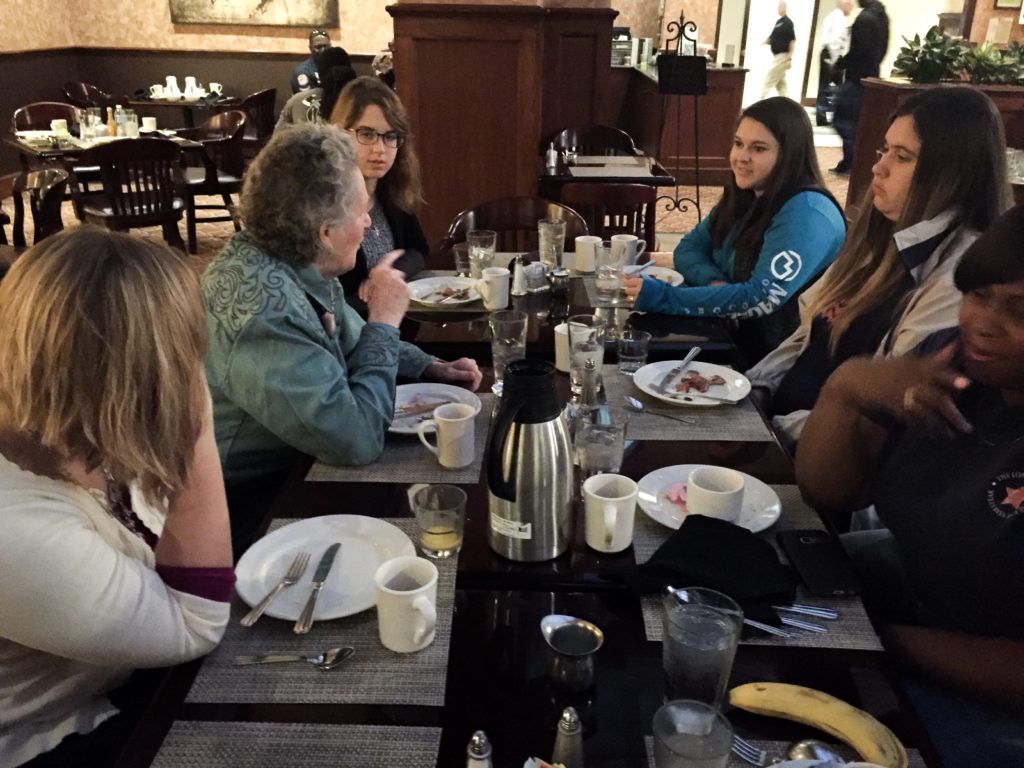 Dr. Grandin having breakfast with students