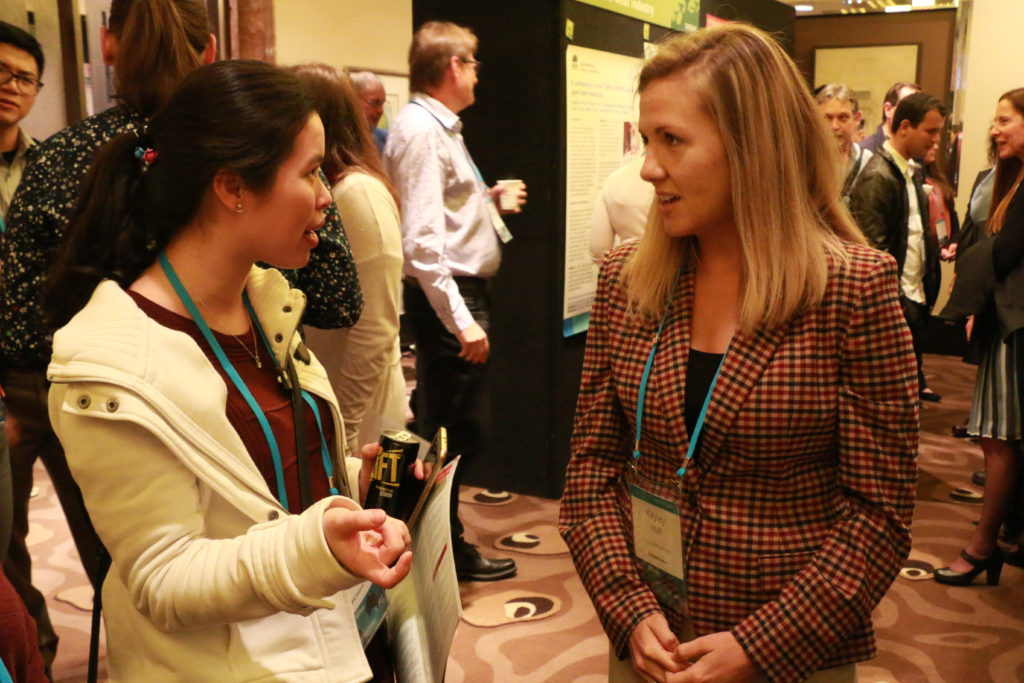 Kayley Wall (right) discussing the findings of her research at the 64th International Congress of Meat Science and Technology in Melbourne, Australia