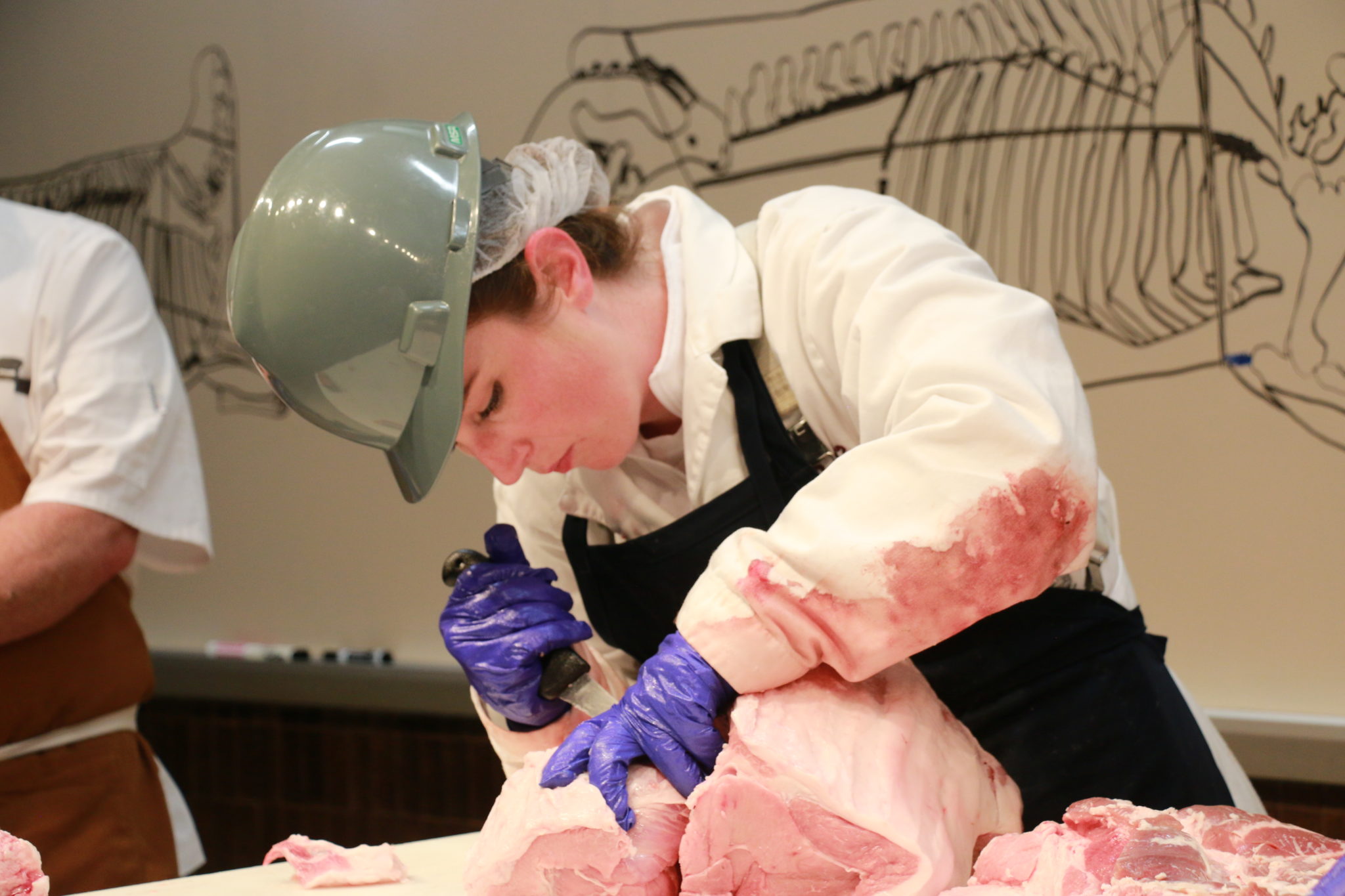 Clay Eastwood, National Pork Board, cutting pork at the NAMI Center of the Plate Training