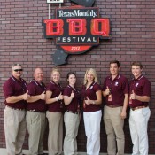 Texas Aggies at Texas Monthly BBQ Festival 2012, standing in front of that tears logo on a brick wall. 